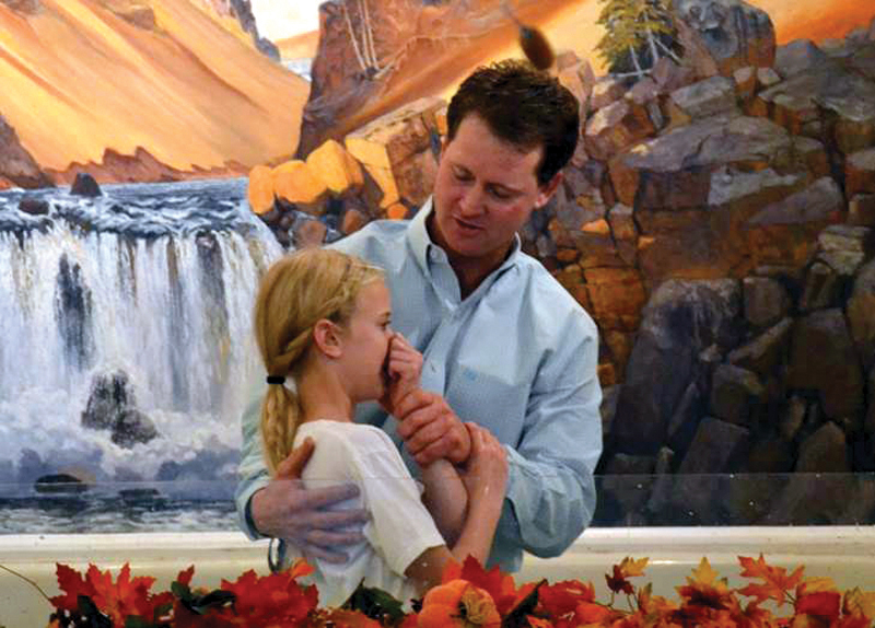 Shawn Nunley, member of Sterling, First, baptizes his daughter, Jadyn.