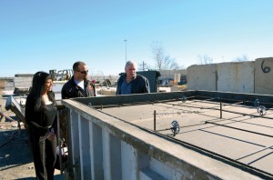 Long Term Recovery Coordinator Sonya Saffa and BGCO disaster relief director Sam Porter, right, listen as Metheny Pre-Cast of Oklahoma Production Manager Sean Satlow explains the casting process of a storm shelter.
