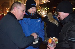 Mark Spena and Doug Melton distribute food to homeless in Moscow.