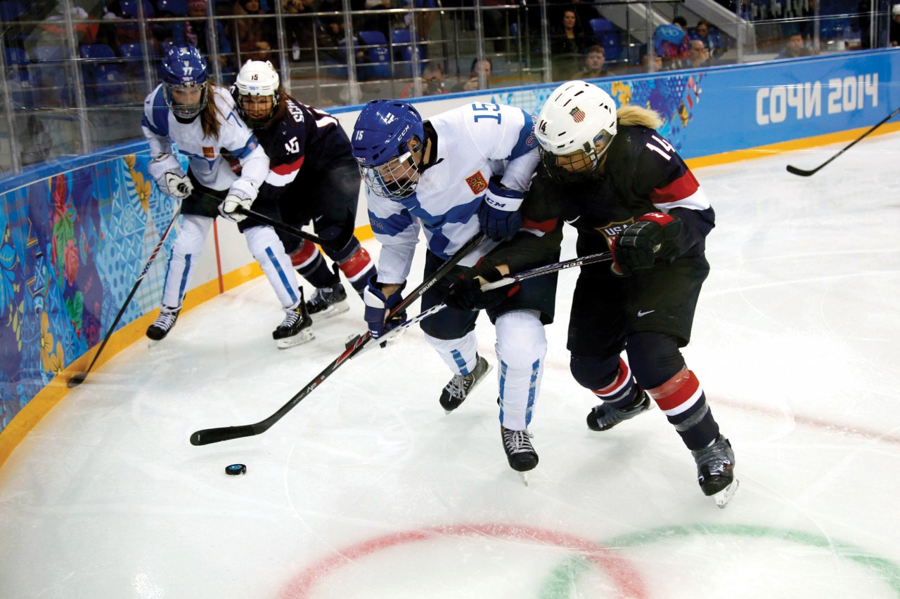 Schleper (15 in background) battles a Finland player. Schleper shares how her Christian faith impacts her game.