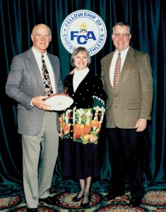 Lower poses with his wife Elaine and legendary Dallas Cowboys coach Tom Landry at an FCA event.