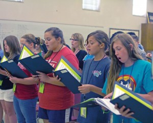 Resound choir, composed of junior high students, quickly learned their performance pieces with one full day of practice before their performance.