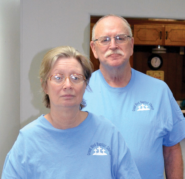 Katie Wallis and Oklahoma City, Grand Boulevard Pastor Don Hunter stand were Wallis passed out after sustaining a heart attack in the church’s Fellowship Hall on Jan. 4. (Photo: Bob Nigh)