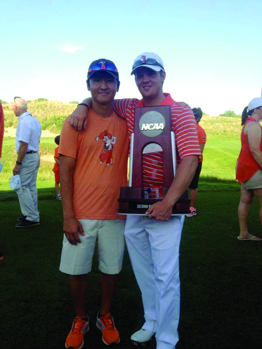 Ian Davis, above right, poses with his friend and OSU golf teammate Sam Lee at the 2014 NCAA Golf Championship, where the Cowboys finished as National Runners-up. (Photo: Provided)