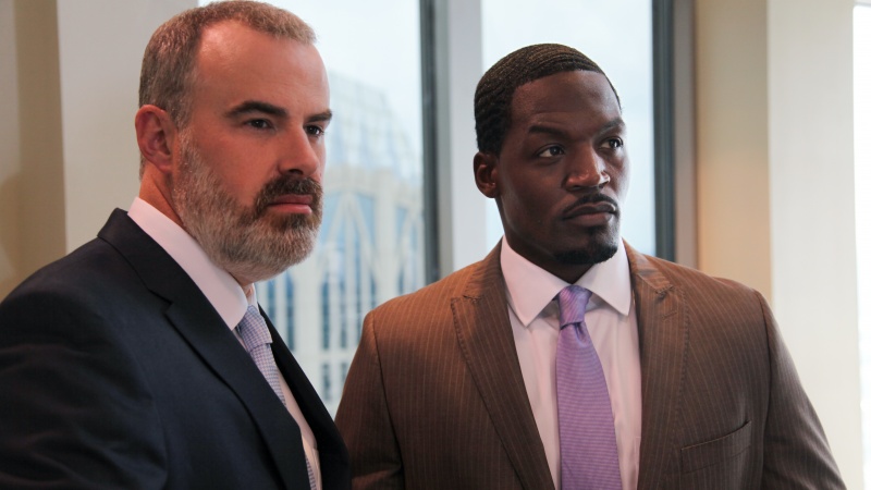 Coleman (Alex Kendrick) stands with Tony (T.C. Stallings), his top pharmaceutical salesman, after a tense board meeting in downtown Charlotte. (Courtesy of AFFIRM Films/Provident Films, Photo: Judd Brannon)