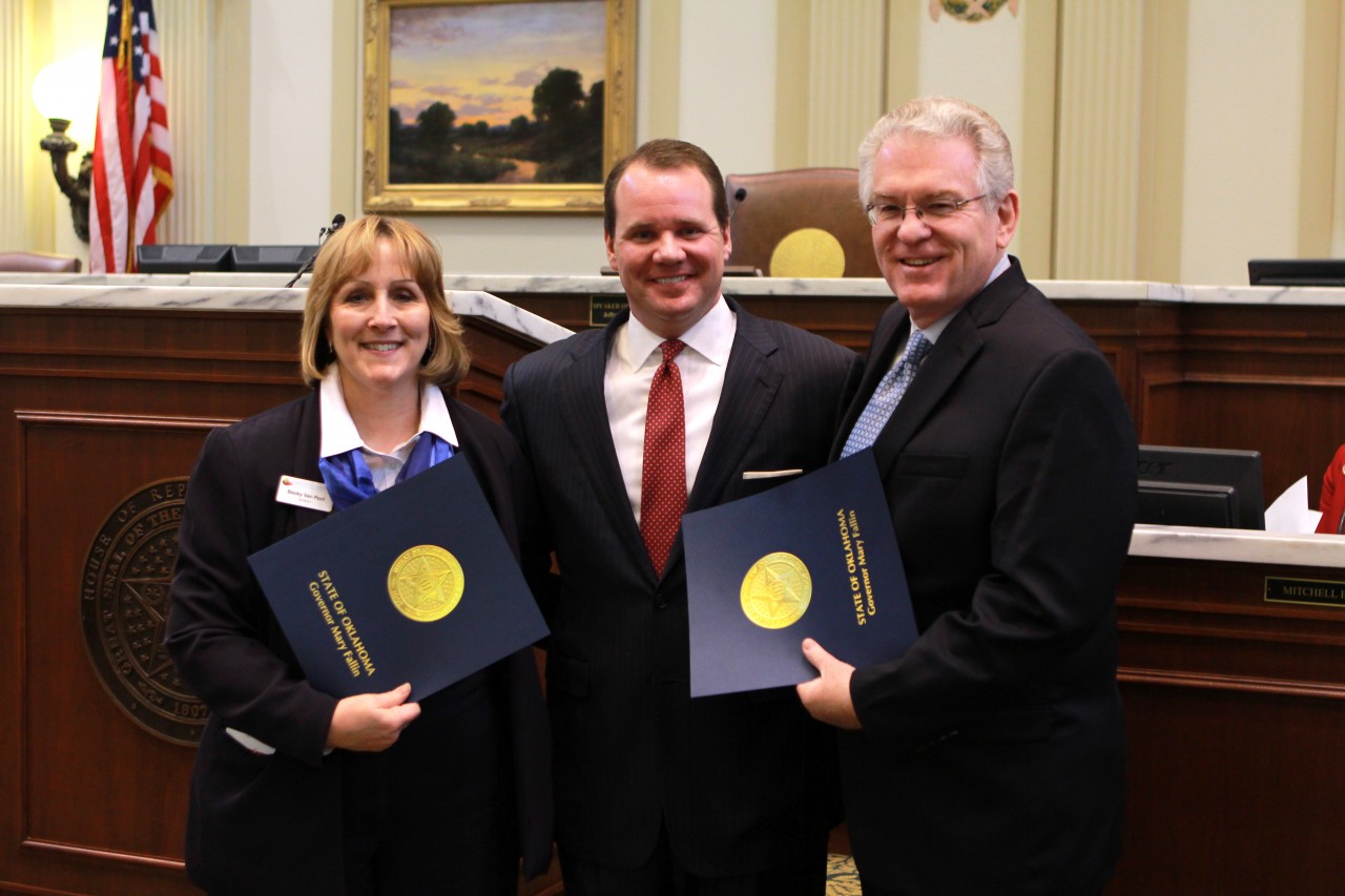 Oklahoma Lt. Gov. Todd Lamb, pictured center, spoke to the Rose Day gathering and presented a joint citation from himself and Oklahoma Gov. Mary Fallin to Dr. Anthony L. Jordan, Executive Director-Treasurer of the Baptist General Convention of Oklahoma (BGCO), pictured right, and Becky VanPool, Executive Director of Catholic Charities of Oklahoma City. The citation praised the BGCO and Catholic Charities for their shared work for the unborn. (Photo: Grant Bivens)