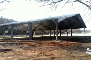 The sports pavilion at the recreation area down by the river now features covered basketball courts. 