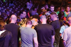 Leaders prayed over attendees during the Saturday worship session (Photo: Tiffany Zylstra)