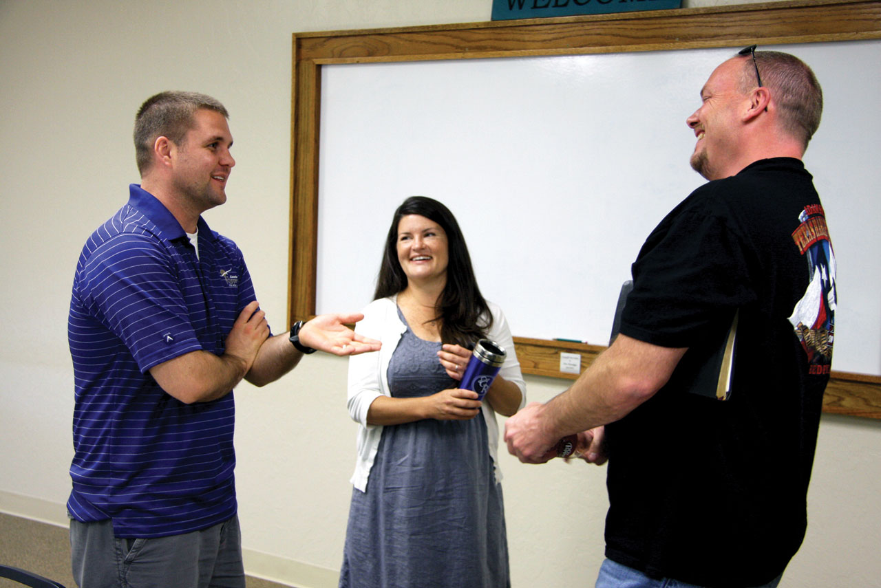 Donnie Frey, left, and his wife Sarah visit with a fellow Sunday School class member (Photo: Brian Hobbs)