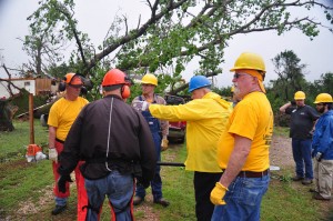 Team leader Deyrl Kastner (Blue hard hat) sets the team in motion in Bridge Creek. (Photo: David Crowell)