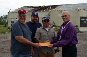 BGCO representative Bob Shelton, right, presents a check to Ridgecrest Church Pastor David Rivers, second from right, as Grady Association Director of Missions Chuck Utsler, left, and Ridgecrest’s Children’s Minister, Derreck Fraysur, look on. (Photo: Bob Nigh)