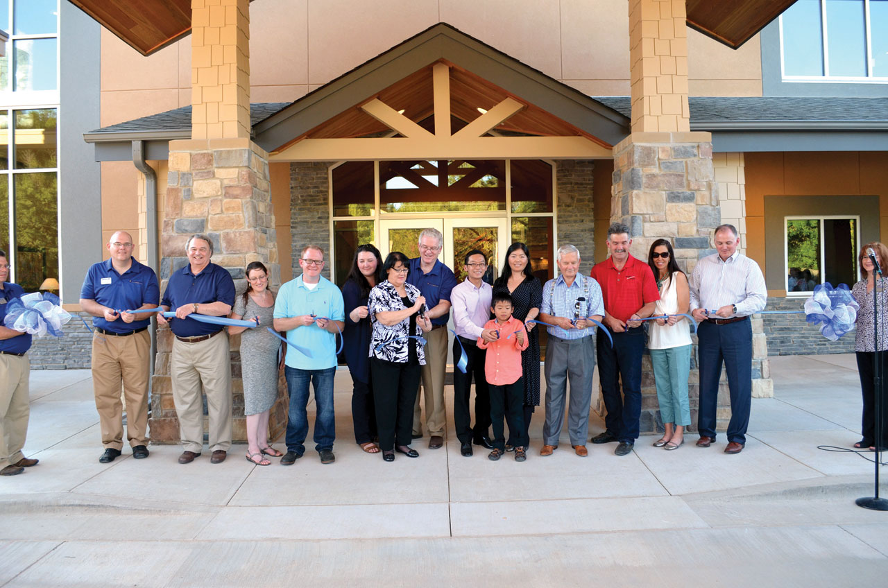 Cutting the ribbon to dedicate the Jordan Welcome Center June 11 are, from left, BGCO Conference Centers Director Jason Langley, former BGCO President Nick Garland, Janae and Adrian Jordan, Alisha Jordan, Polla and Anthony Jordan, David, Juliet and D.J. Hu, Gene Downing, Rick and Lisa Thompson, and BGCO President Hance Dilbeck (Photo: Bob Nigh)