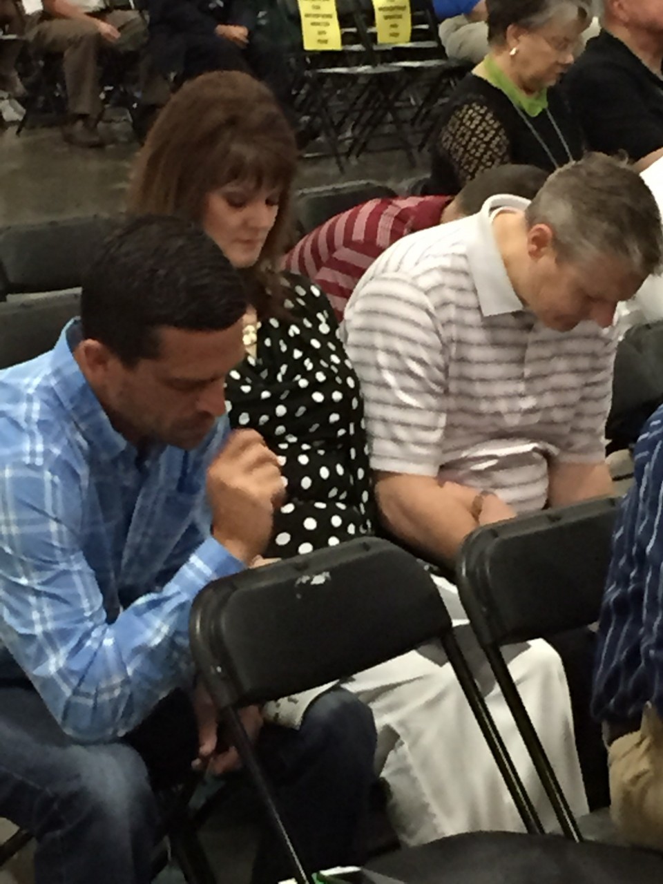 From left, Pastor Will Wilson, Jr. of Tecumseh, New Hope, and Lana and Pastor Doug Melton of Oklahoma City, Southern Hills, participate in a prayer time at the SBC meeting (Photo: Brian Hobbs)