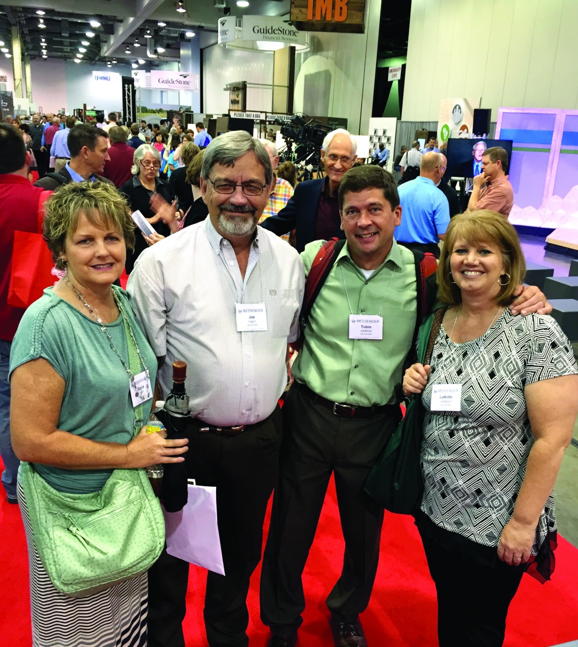 From left, Gayla and Pastor Joe Ligon of Marlow, First, with Pastor Tobin and LaNette Jackson of Oklahoma City, Trinity, visit in the exhibition hall at the SBC annual meeting (Photo: Brian Hobbs)