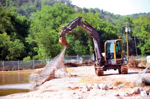 The fence is pulled out of the lake at the Falls Creek wastewater facility after the Washita River destroyed it. (Photo: Bob Nigh)