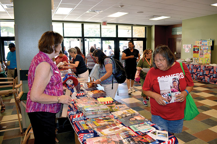 Attendees pick up free literature provided by the Ardmore, First Daughters of the American Republic chapter. (photos: Bob Nigh)