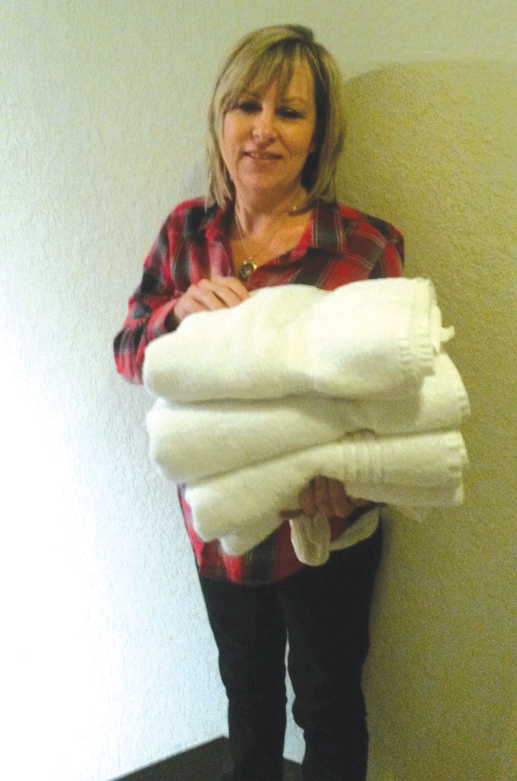 photo: provided Jana Hughes, children’s director,  provides towels for candidates.