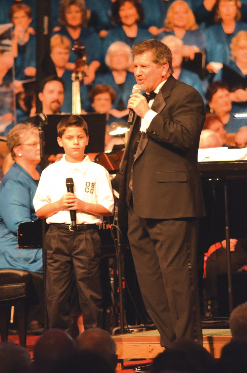 (photos: bob nigh) Oklahoma Baptist Children’s Choir member Cody Ware is introduced by SCM/SCW director Randy Lind before singing as part of a trio with SCW members Dru Baker and Stacie McCracken