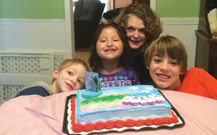 photos: provided Chloe Gattis, with her mom, TeAta, and family shows off her 6th brithday cake. 