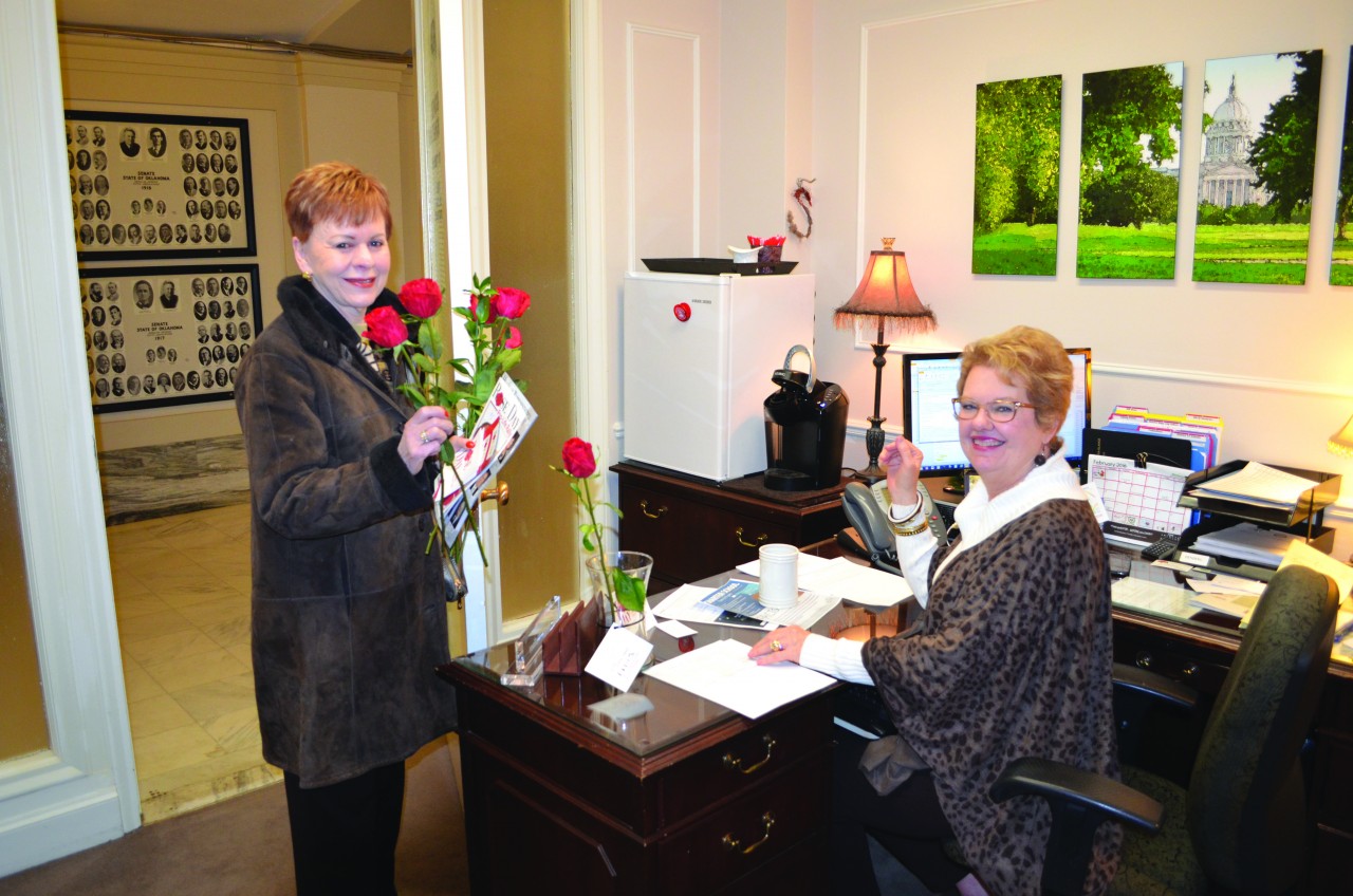 A Rose Day participant delivers a rose to Sen. Rob Standridge’s office (Photo: Chris Doyle)