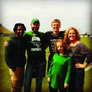 Malcolm Tubbs, left, pictured with his adopted family, the Jensons. John, second left, and Tammy, right, included Malcolm with their son Mack and daughter Hannah (Photo: Provided)