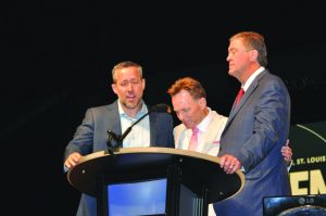 From left, J.D. Greear, Ronnie Floyd and Steve Gaines demonstrate a “moment of unity” in prayer at the SBC annual meeting. Gaines won the residential election, as Greear resigned as a candidate (Photo: Jennifer Rash)