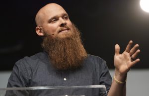 Ministers of the Gospel should endure suffering for the glory of God, pastor Noah Oldham of August Gate Church in St. Louis said during the opening session of the SBC Pastors' Conference Sunday evening June 12. "Suffering goes hand-in-hand with our call, and God is calling us to embrace it for His glory and our joy," he said. (Photo: Miranda Johns)