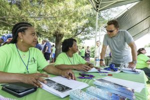 (Left to right) Catherine Corpus and Lina Freeman, members of Idlewild Baptist church in Lutz, Fla., visit with Ronnie Floyd, president of the Southern Baptist Convention, during a block party at Sterling Baptist Church in Fairview Heights, Ill. The block party was part of Crossover St. Louis 2016, held prior to the annual meeting of the Southern Baptist Convention June 14-15 at America's Center in St. Louis. (Photo: Matt Miller)