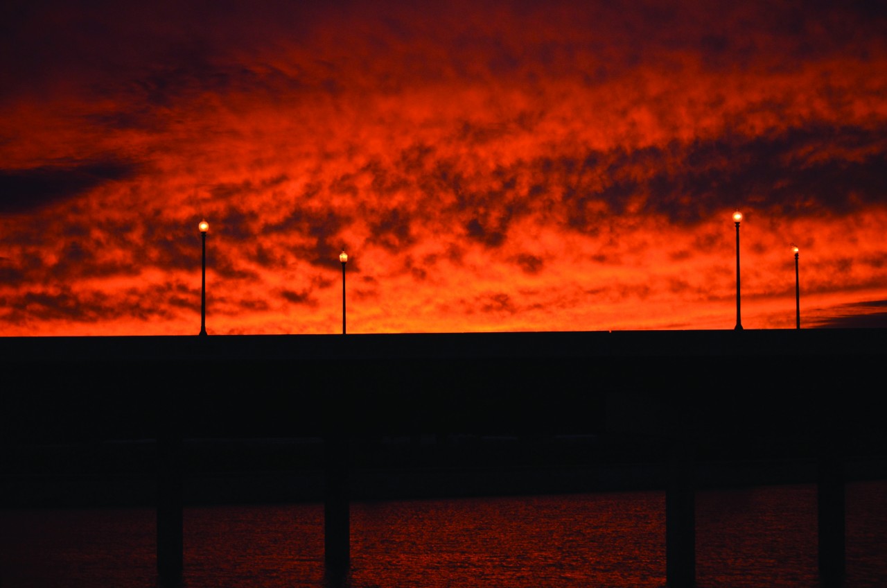 The sky is ablaze above a Western St. bridge in Oklahoma City. 