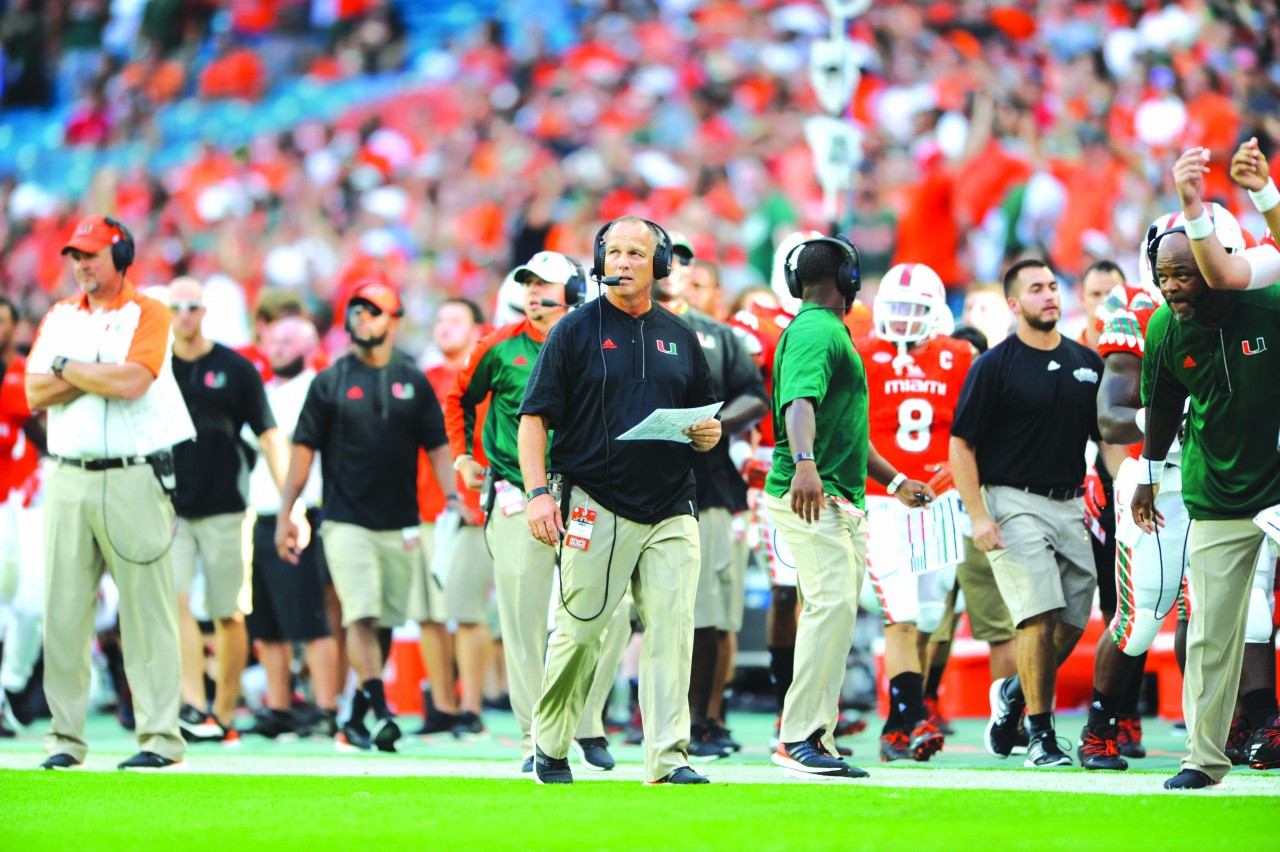 Coach Richt offers the Word of God to his team