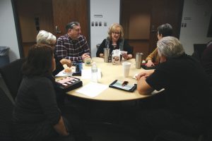Cathy Price, BGCO Church Planting ministry assistant, center, reads her Legacy Letter to her table mates during an At-Home Day session at the Baptist Building