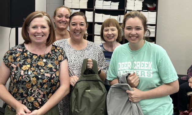 Singing ChurchWomen offer backpacks of love